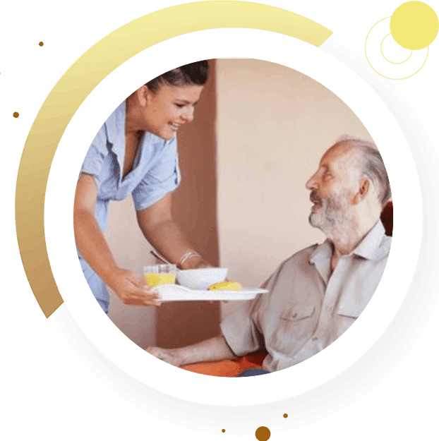 A person serving food to an elderly man.